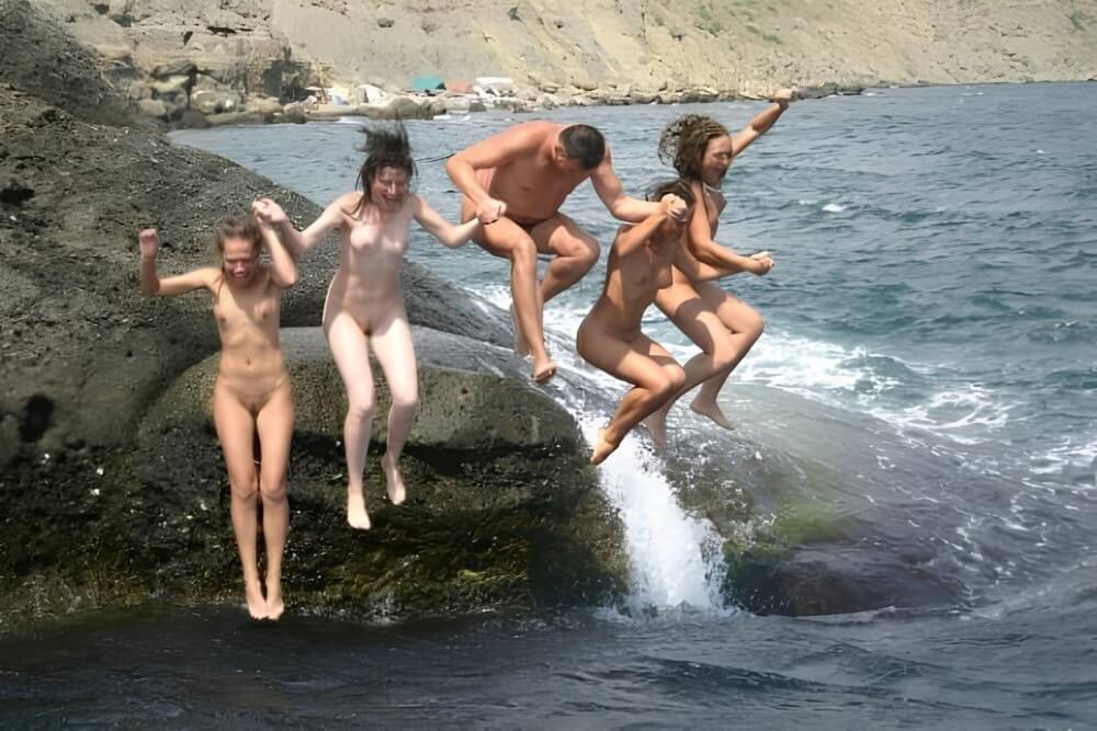 Mens and girls nudists on a beach - A nudist values simplicity in life and naturalness in expression