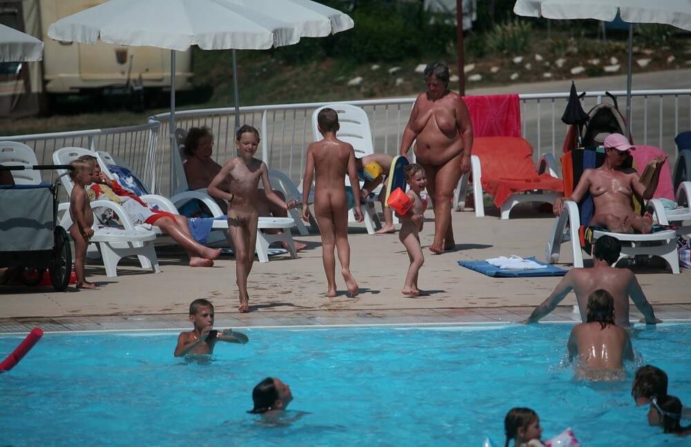 Naturist Afternoon Pool Games pics - Nudism helps people accept themselves