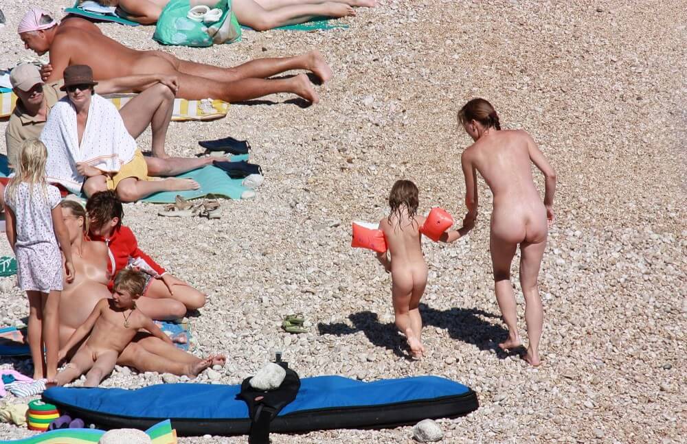 Orange Floaty Safety First Naturist pics - Naturists value a simple life